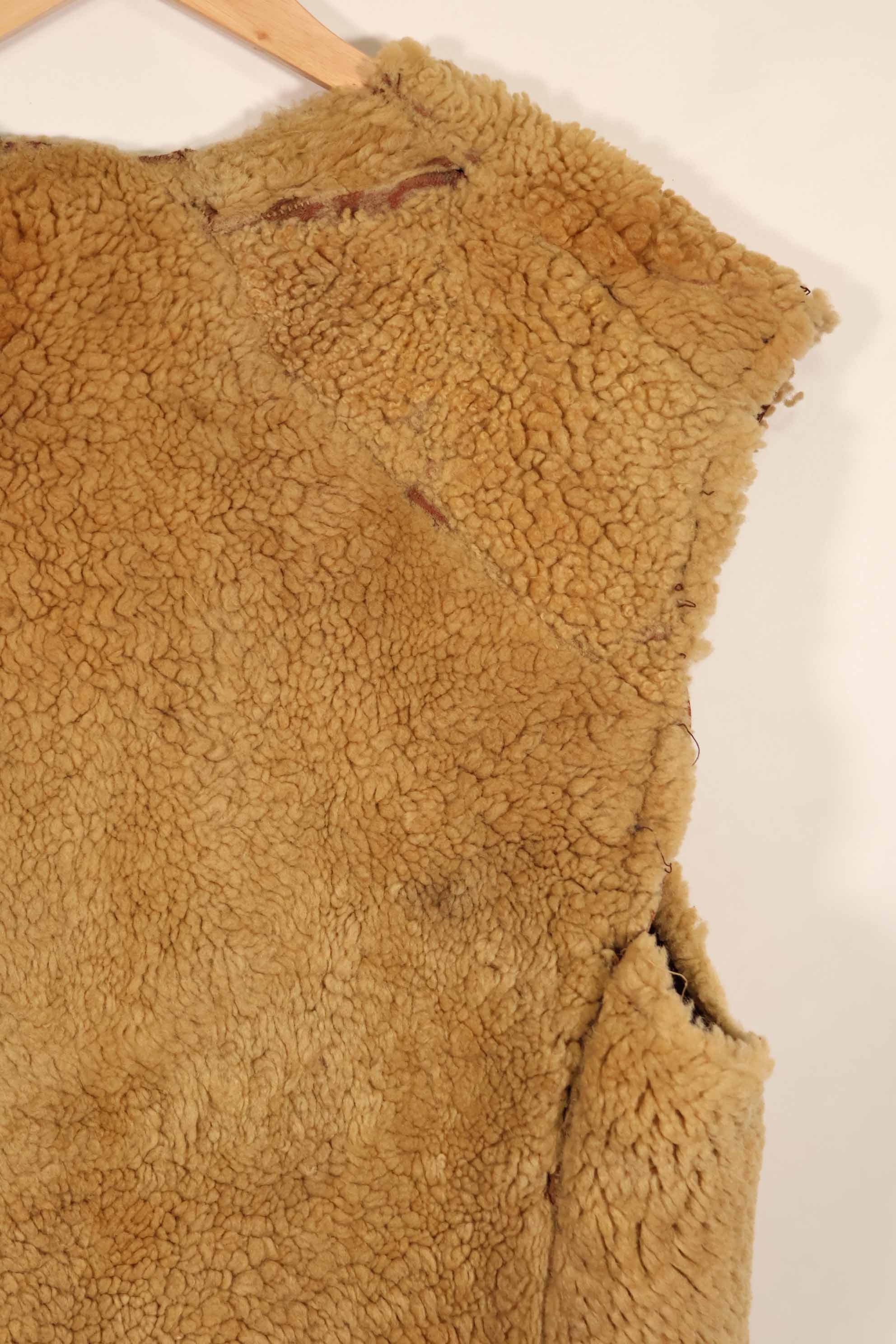 Civilian 1960s-70s sheepskin vest, used, scratches, stains.
