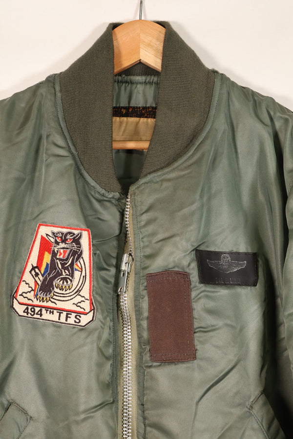 1950s, estimated size 40–42, U.S. Air Force B-15D flight jacket, modified with shearling, includes patches, used