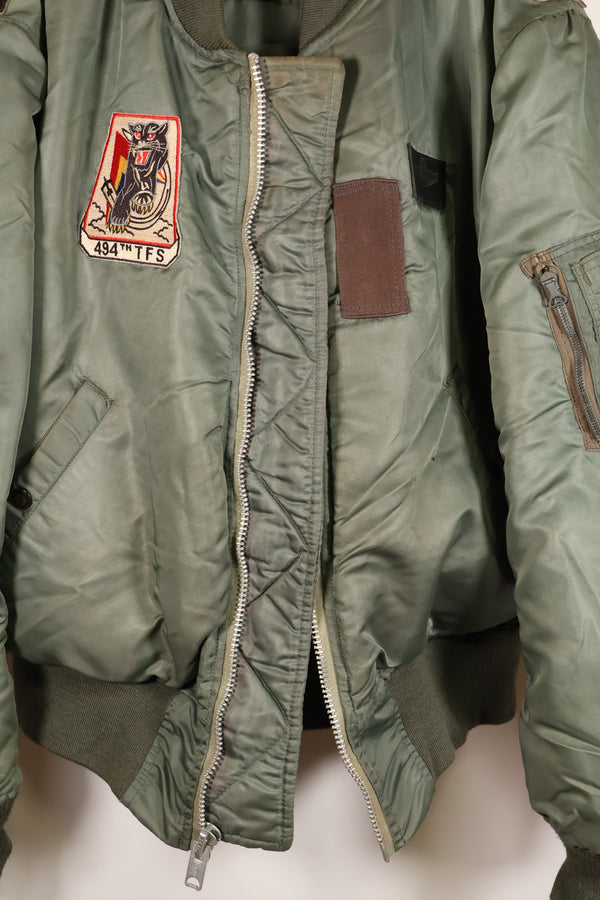 1950s, estimated size 40–42, U.S. Air Force B-15D flight jacket, modified with shearling, includes patches, used