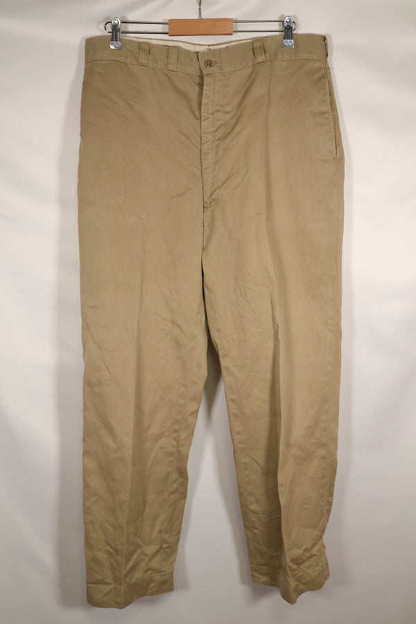 1960s, estimated 34-36 US Army cotton khaki pants, used.