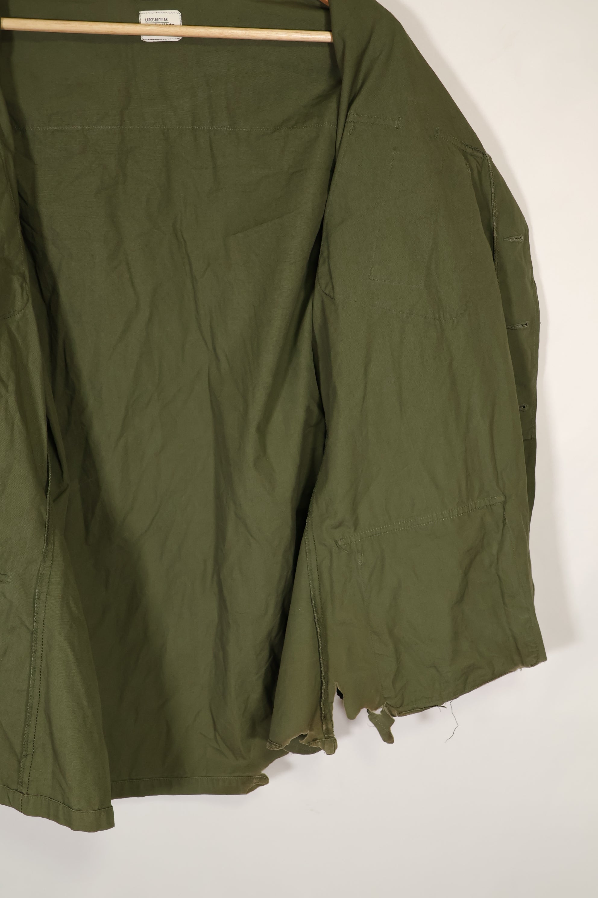 Real 1966-1967 3rd Model Jungle Fatigue Jacket L-R with damage.