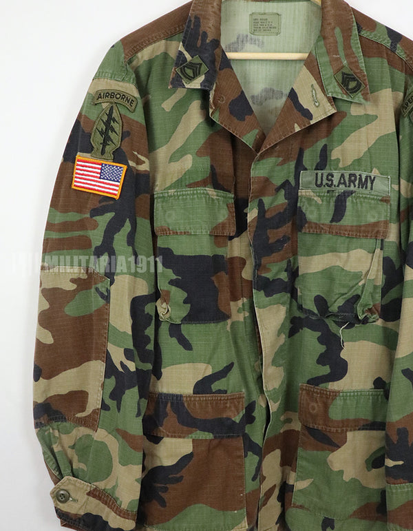 US SURPLUS U.S. Army Special Forces Woodland Camouflage Jacket, 1996, with patches.