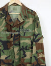 US SURPLUS U.S. Army Special Forces Woodland Camouflage Jacket, 1996, with patches.