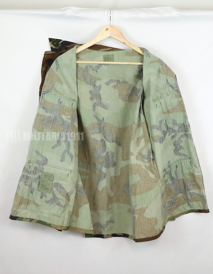 US SURPLUS U.S. Army Special Forces Woodland Camouflage Jacket, 1996, with patches.