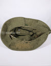 Real U.S. Army boonie hat with metal insignia, faded.